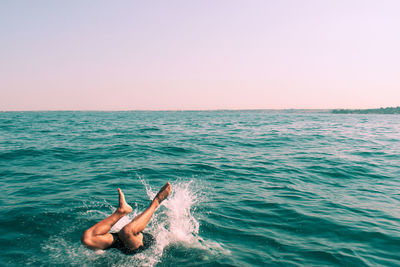Man diving into the lake