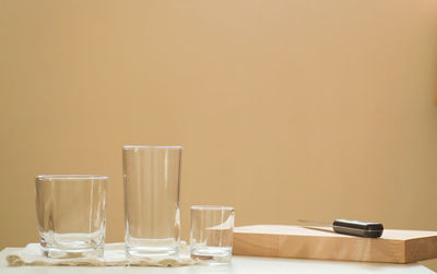 Close-up of empty glasses on table