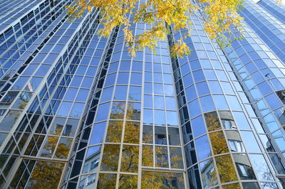 Low angle view of modern office building against sky