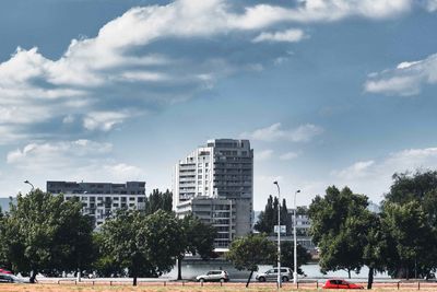 View of city buildings against sky