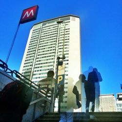 Low angle view of people in city