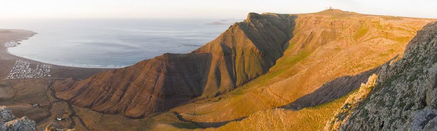 High angle view of rocks on mountain against sky