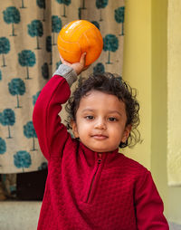 Portrait of cute girl standing at home