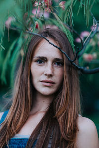 Portrait of woman against trees