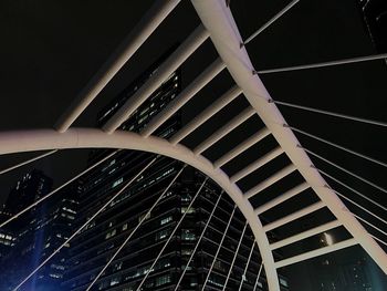 Low angle view of modern building against sky at night