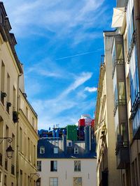 Residential buildings against blue sky