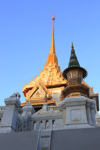 Low angle view of building against blue sky