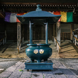Incense burner at gumyoji temple in yokohama, japan with gosan-no-kiri and hidari-mitsudomoe symbols