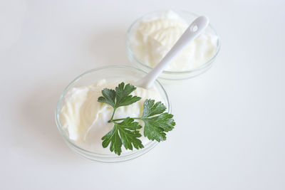 High angle view of breakfast on table against white background