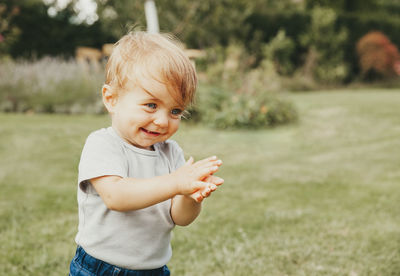 Cute girl playing on field