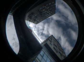 Low angle view of building against cloudy sky