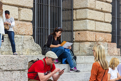 Group of people sitting outdoors