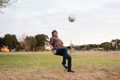 Man about to kick soccer ball