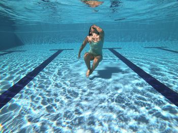 Full length of woman swimming in pool