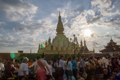 Group of people in temple against building