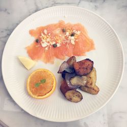 High angle view of fish in plate on table