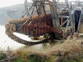 High angle view of abandoned machinery on field