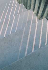 High angle view of shadow on footpath