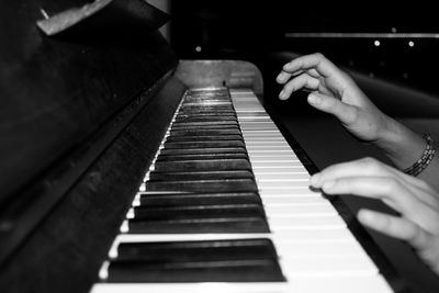 Cropped image of pianist playing piano