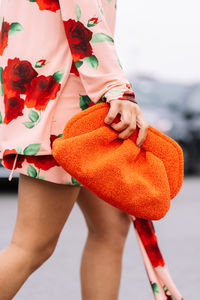 Midsection of woman holding gift