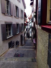 Street amidst houses in city