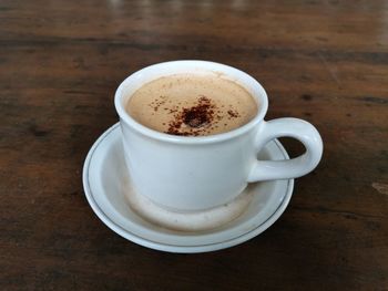 Close-up of coffee cup on table