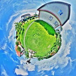 Panoramic view of green landscape against sky