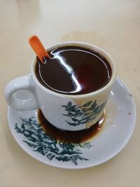 High angle view of coffee cup on table