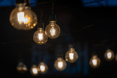 Low angle view of illuminated light at night