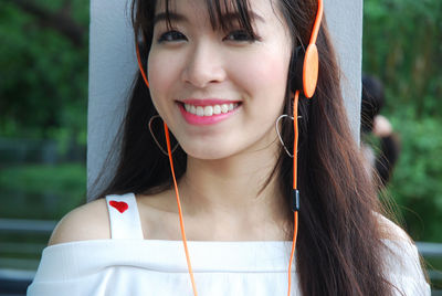 Close-up portrait of a smiling young woman