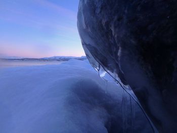 Close-up of frozen sea against sky