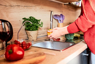 Midsection of woman preparing food on table