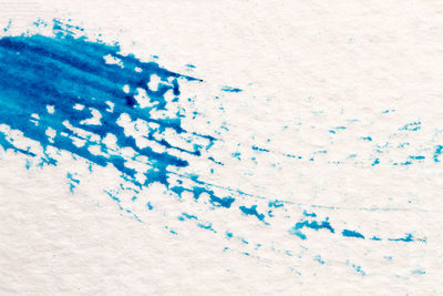 Close-up of paper painting on white wall