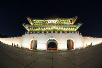 Low angle view of illuminated temple against sky at night