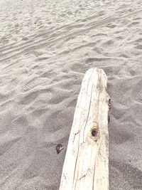 High angle view of wooden post on beach