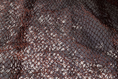 High angle view of a burgundy net on a white background