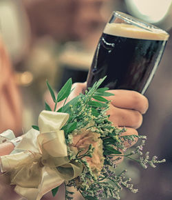 Close-up of hand holding bouquet