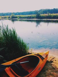 Cropped image of boat in calm lake