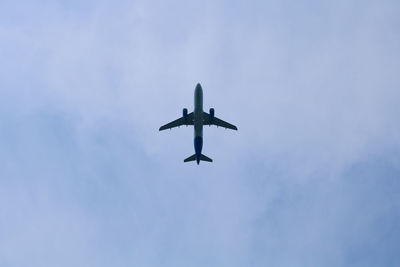 Low angle view of airplane in sky 