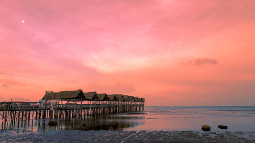 Scenic view of sea against orange sky