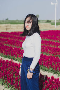 Full length of woman standing on field