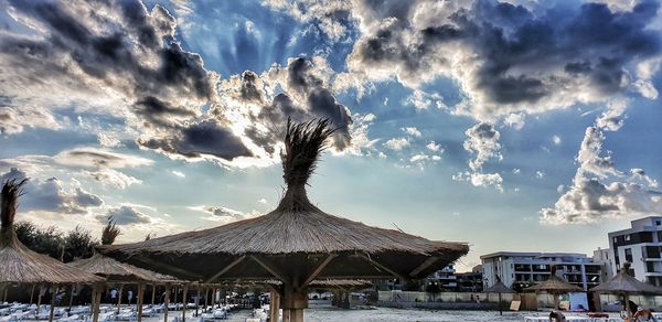 Panoramic view of building and trees against sky