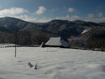 Scenic view of snowcapped mountains against sky