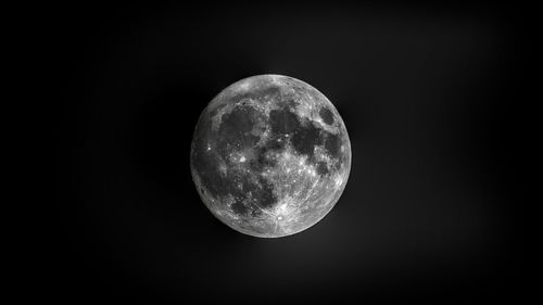Full moon against clear sky at night
