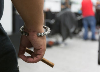 Cropped image of woman holding cigarette