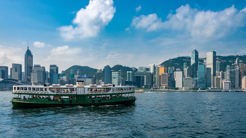 Boats in sea against sky