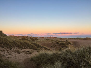 View of landscape against sky during sunset