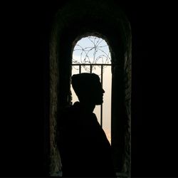 Woman in dark room