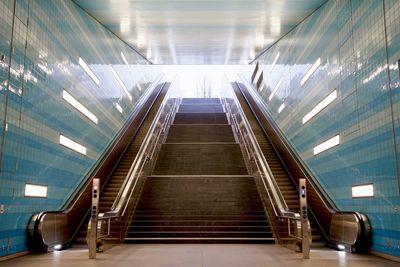 Staircase in illuminated underground walkway