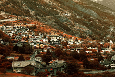 High angle view of townscape by mountain